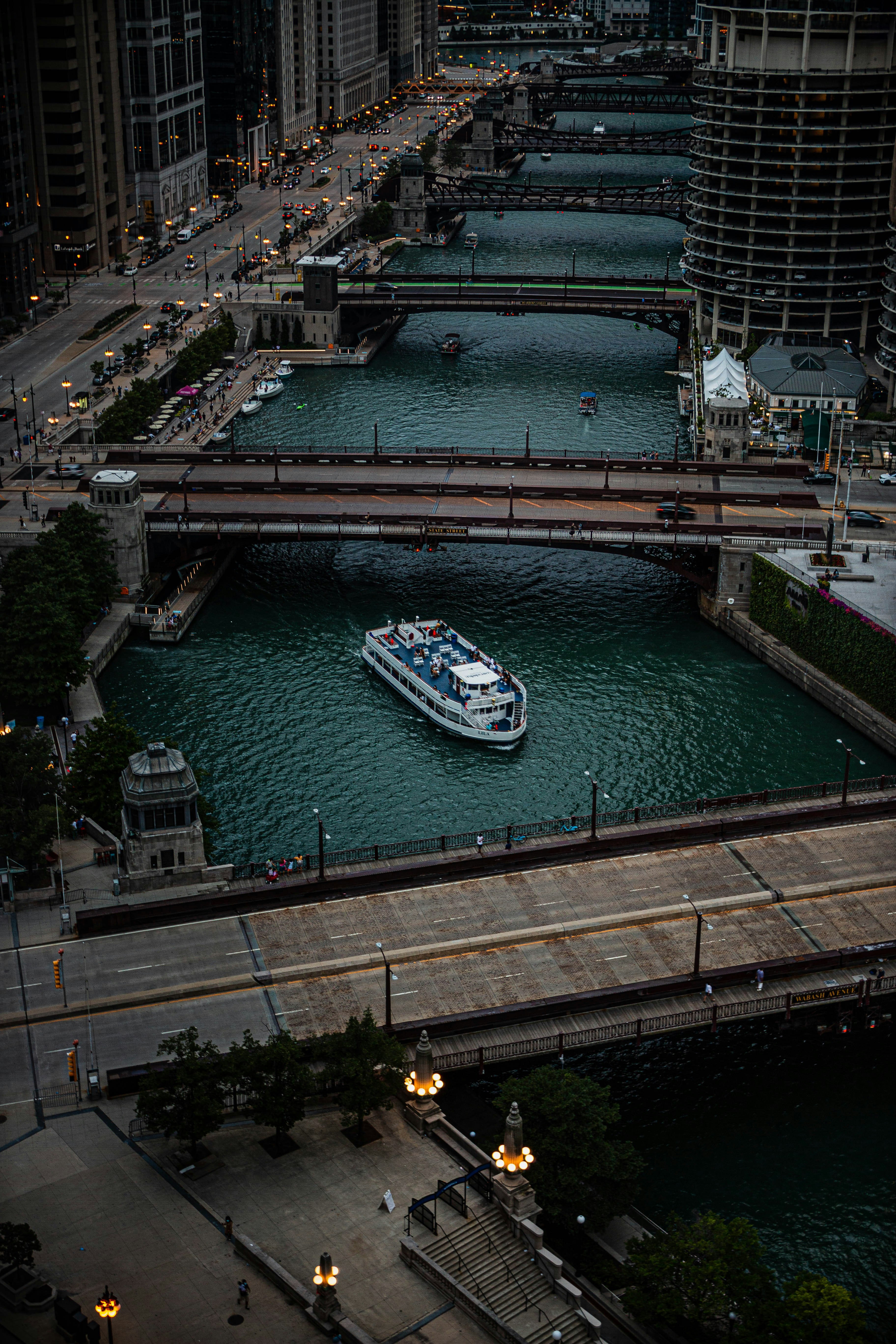 white and green boat on water during daytime